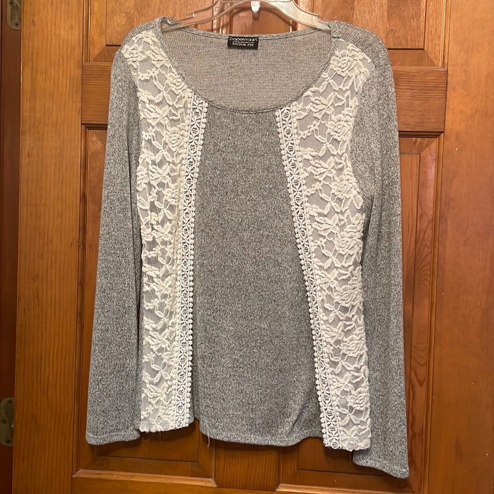 Lace details take this sweater from “everyday” to “wow”